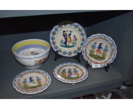 Four French HR Quimper plates and a porridge bowl all having typical delft style designs