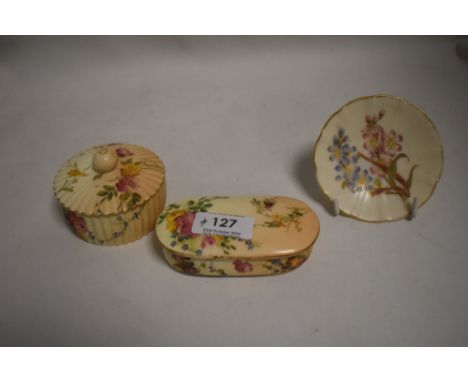 Three pieces of Royal Worcester including lidded trinket cases and a miniature pin dish
