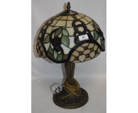 A modern Tiffany style side lamp with leaded light shade