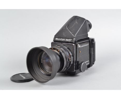 A Mamiya Professional Camera, serial no C63885, delay to shutter firing, appears to fire on one speed, body P-F, paint scratc