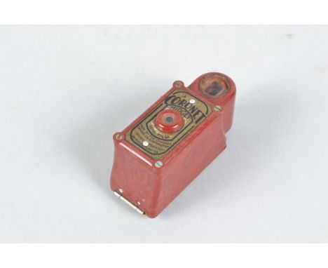 A Red Coronet Midget Subminiature Camera, bakelite 16mm camera, shutter working, back opens, body F, corrosion to viewfinder 