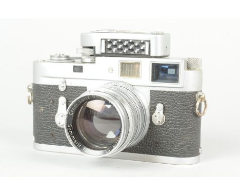 A Leitz Wetzlar Leica M2 Camera, chrome, serial no 988 705, 1960, body F-G, scratches, tarnishing to top plate, brassing to b