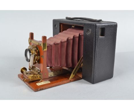 A No 4 Cartridge Kodak Roll Film Camera, serial no 2036, 5 x 4in format on 104 roll film, circa 1898, red bellows, body F, pa