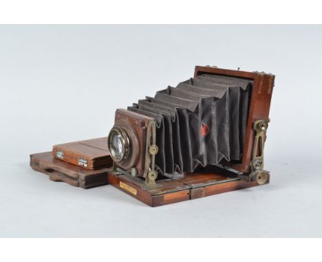 A Lancaster Special Instantograph Tailboard Quarter-Plate Camera, square-cornered black bellows, rear ground glass present F,