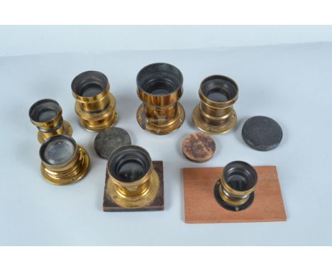 Seven Medium Brass Lenses, comprising a Krauss Paris Tessar 210mm f/4.5 lens, serial no a Ross 8½ x 6½in Rapid Symmetrical le