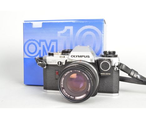 An Olympus OM10 Camera, serial no 1807559, shutter working, meter responsive, chrome,with maual adaptor, body G-VG, with F Zu