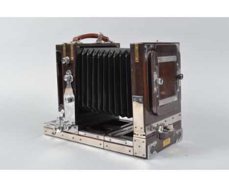 An S &amp; K Modern Tailboard Field Camera, 4½ x 3½in,  made in Japan, hardwood body, with chrome fittings, body G, some ligh