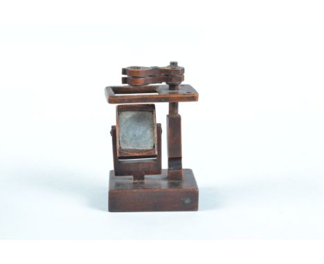 A Mahogany Simple Microscope,  probably home-made, of rectangular form, with two objectives, with pivoting apertures, simple 