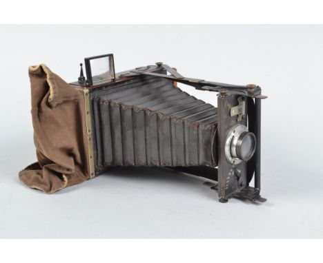 A Newman &amp; Guardia Nydia Folding Plate Camera, Rd no 352241, 3¼x4¼in format, shutter fires, sluggish, body G, brassing to