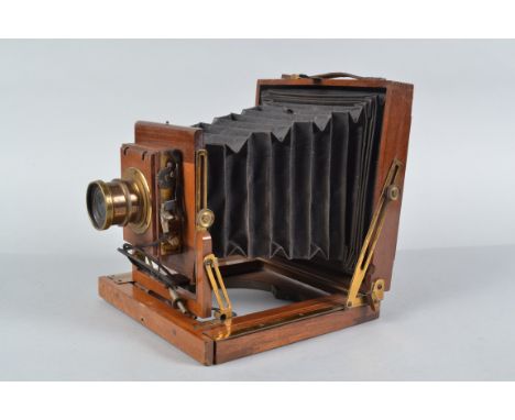 A Half Plate Mahogany Field Camera, square-cornered black bellows, focusing screen missing, double extension, body F-G, a clo