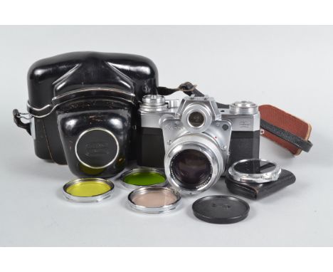 A Zeiss Ikon Contarex Bull's Eye Camera, serial no Z 47965, shutter working, meter responsive, timer sluggish, body G-VG, lig