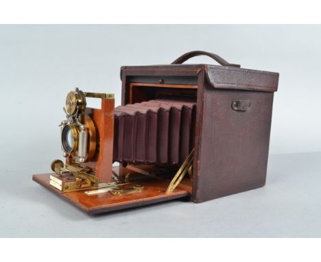 A No 4 Folding Kodak Hand or Stand Camera, 5 x 4in, serial no 8438, circa 1896, tapered red bellows, box-shaped leather cover