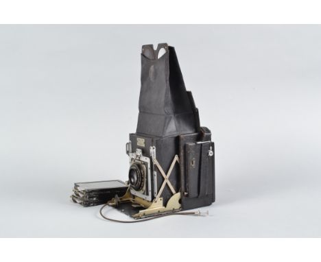 A Newman &amp; Guardia Folding Reflex Camera, shutter fires, very stiff to wind, shutter curtain creased, body F-G, wear to e