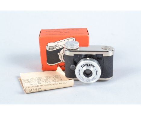 A Chrome-Black Petie Subminiature Camera, supplied by Walter Kunik of Frankfurt, VG, shutter working, Achromat 25mm f/9 lens,