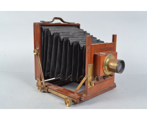 A Half Plate Mahogany Field Camera, tapered black bellows, screen present, condition F, with a Thornton-Pickard shutter, work