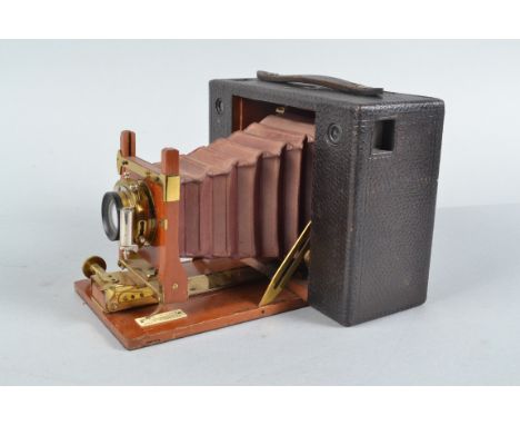 A No 4 Cartridge Kodak Roll Film Camera, serial no 1320, 5 x 4in format on 104 roll film, circa 1898, red bellows, body F-G, 