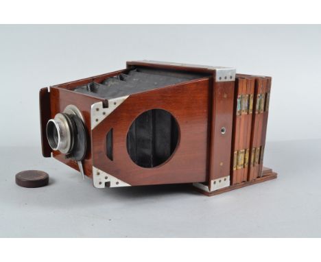 A Shew Patent Eclipse Half Plate Folding Plate Camera, circa 1890, aluminium corner and edging to mahogany body, square-corne