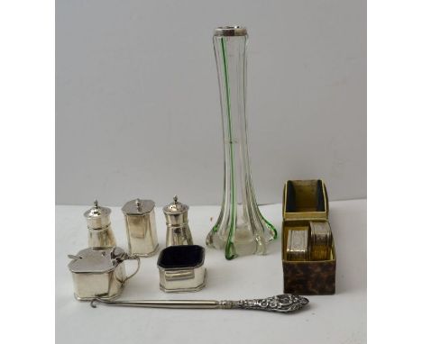 JB Chatterley &amp; Sons, a silver three piece condiment set, a cased pair of silver napkin rings, a pair of silver pepper po