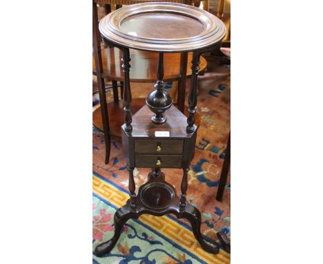 A 19th century mahogany wash/wig stand the unit supported on a tripod base 79 cm high