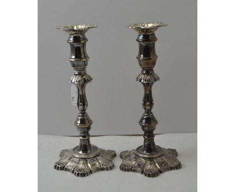 Garrard &amp; Co. Ltd. A pair of Georgian design silver candlesticks, with removable sconces, on petal form bases, Birmingham