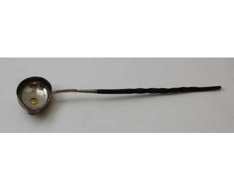 A George III silver ladle, with pouring lip, inset gold coin, dated 1786, fitted twisted whale bone handle&nbsp;