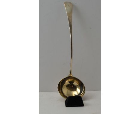 An 18th century silver soup ladle, gilded interior to the bowl. Old English pattern handle, with engraved Knight in armour cr