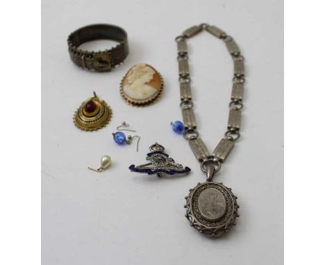 A Victorian silver locket on chain, a silver buckle form bangle, a cameo, and other items of jewellery