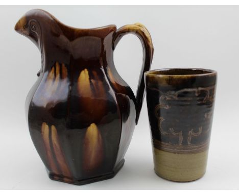 A Winchcombe pottery stoneware vessel, with stylised tree decoration, together with a treacle glazed jug