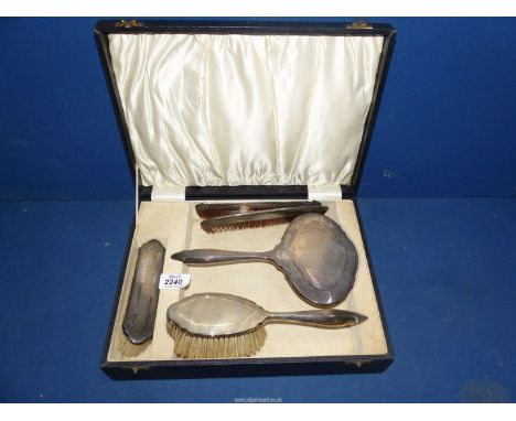 A Silver backed brush, comb and mirror seat in original case, Birmingham 1929 makers B. & Co., plus another silver handled co