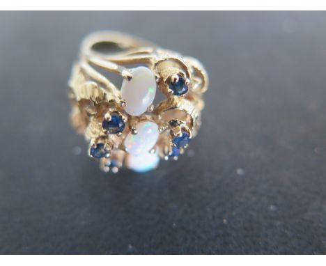 A 14ct Yellow Gold Sapphire and Opal Ring, Size M-N, approx 7.7 grams - light surface scratches and usage wear 