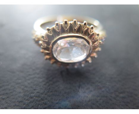 A 9ct gold and oval cut white sapphire ring size R/S - approx weight 3.7 grams - light usage wear 