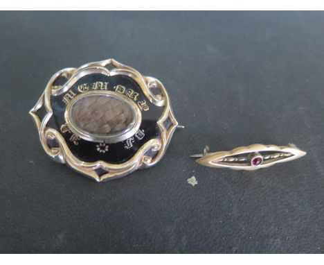 A presumed gold ornate hair and enamel mourning brooch inscribed F.B. Bedford, died August 30th 1857 and one other presumed 9