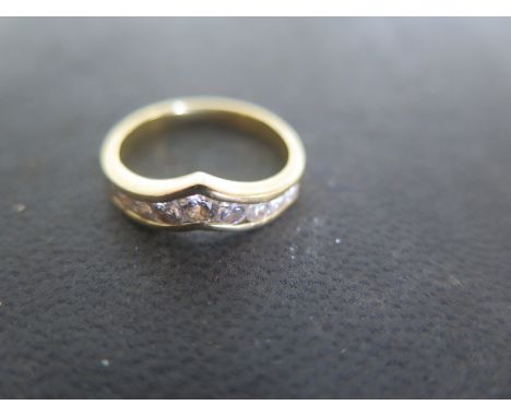 An 18ct yellow gold nine stone diamond, size K-L, approx 2.8 grams - light surface scratches and usage wear 