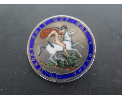 An enamel and silver crown brooch 
