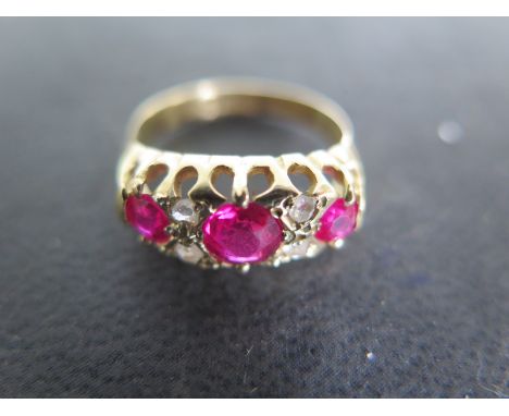 An 18ct yellow gold ruby and diamond ring, size K, approx 3.6 grams, light surface scratches and usage wear 