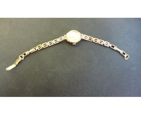 A 9ct Yellow Gold Rotary Ladies Watch - manual wind, 18mm wide including button, approx total weight 12 grams - missing safet