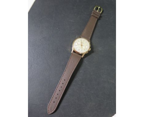 An Evilux gentlemans Suisse chronograph Arabic numerals to even numbers, baton markers to odd, subsidiary dial at 3 o'clock, 