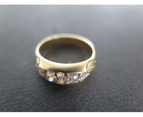 An 18ct yellow gold six stone diamond ring size K - approx weight 5.4 grams - diamonds bright and lively, some usage marks to