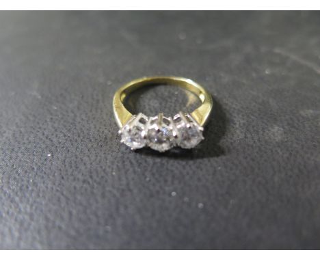 An 18ct yellow gold 3 stone diamond ring, the central stone approx 0.35ct with the side stones approx 0.27ct, ring size J, ap