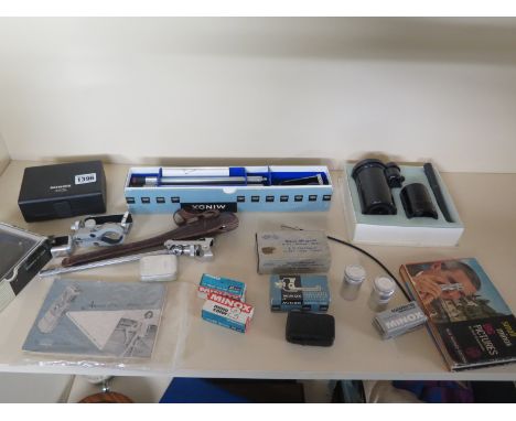 An extensive collection of Minox Film Camera items to include a boxed Minox B complete with leather case, measuring chain and