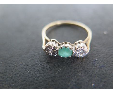 A 9ct yellow gold diamond and emerald ring, size N, approx 1.8 grams - light surface scratches and usage wear 