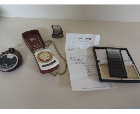 Three early photographic exposure meters or calculators, A late 1920s Zeiss Ikon Diaphot, a Zeiss Ikophot and a scarce 1940s 