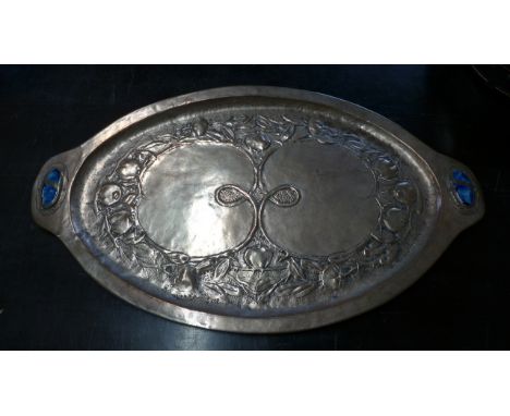 An Arts and Crafts plated copper tray with embossed decoration and enamel plaques, 77cm x 46cm - some wear to tray consistent