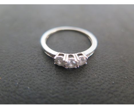 A 9ct white gold three stone diamond ring size N - light usage wear - approx weight 1.2 grams 