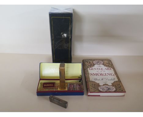 A collection of Dunhill items to include a book of Alfred Dunhill, pipe box, razor blades, enamel badge, two lighters and an 