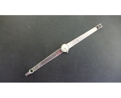 A 9ct white gold Omega ladies wrist watch, manual wind, 15mm wide including button, approx 19 grams, working in saleroom 