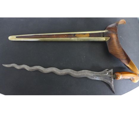 A Tibetan Kris Dagger, walnut scabbard with brass mount 