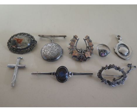 A small quantity of silver jewellery including brooches, crucifix and ring - varying condition 