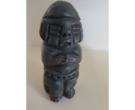A pre-Columbian Mayan South Amercian style figure of a seated man with hands clasped at his chest - black finish, height 13cm