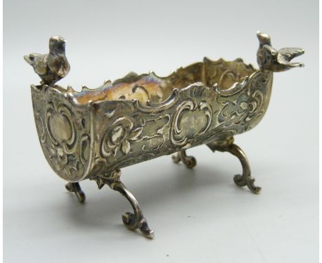 A miniature 800 silver dolls house cradle with dove detail 